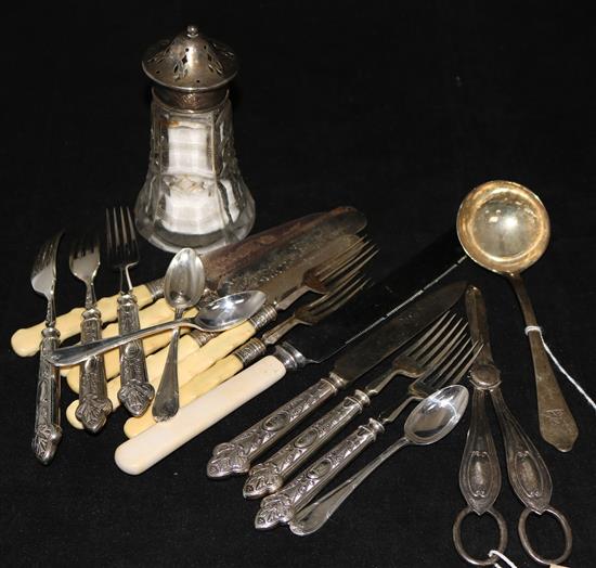 A group of assorted silver and plated cutlery, including a Victorian sauce ladle and a silver mounted sugar castor